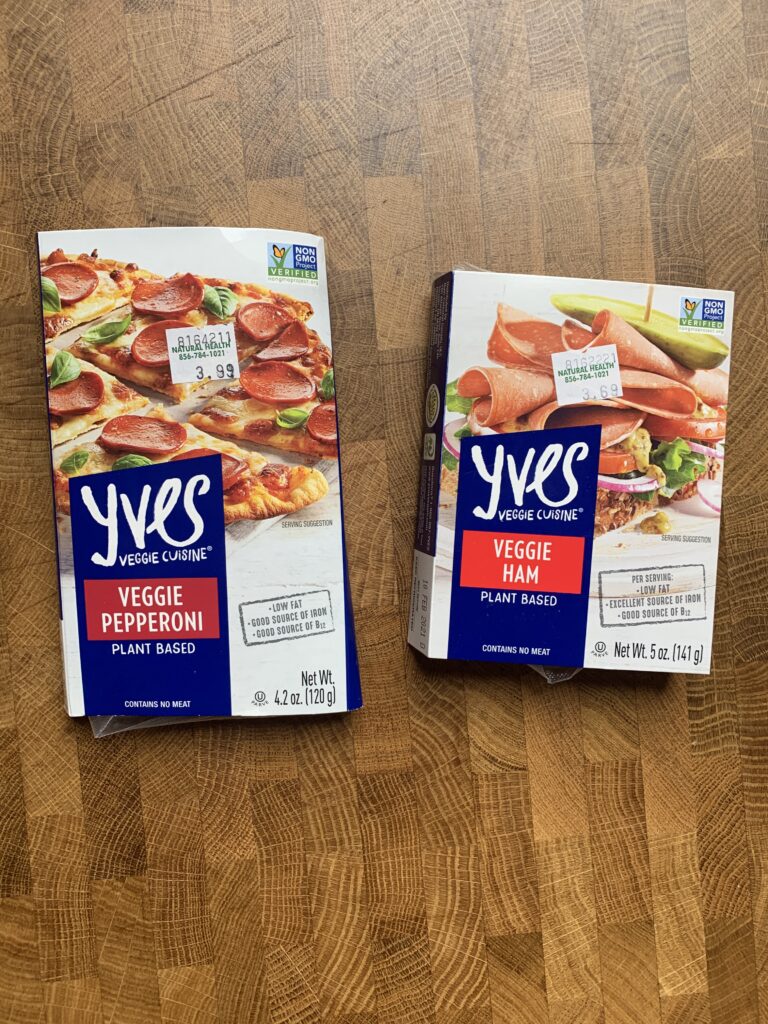 Yves plant-based pepperoni and veggie ham packages.