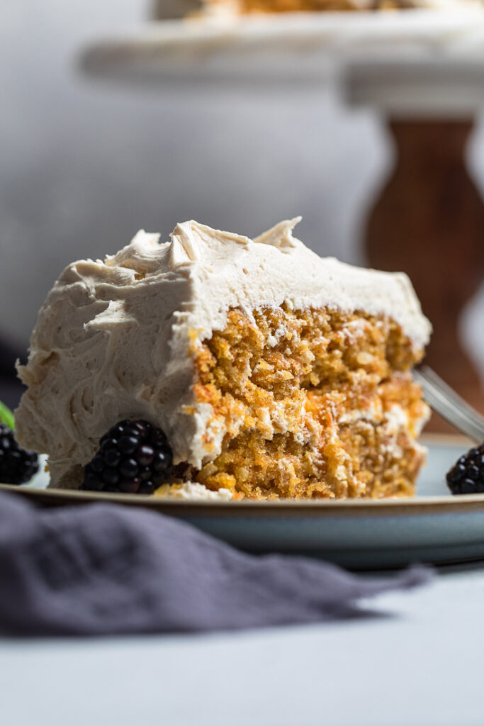 A thick slice of double layered coconut carrot cake. 