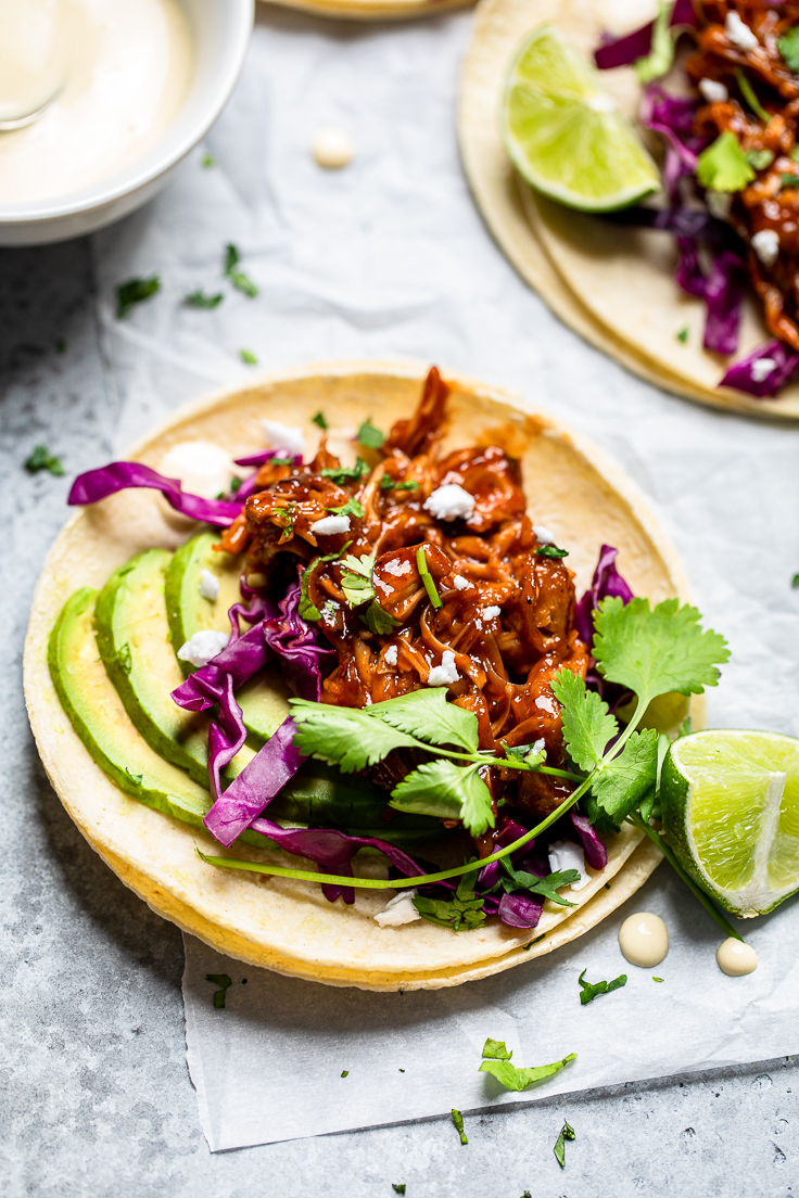 a grilled vegan jackfruit taco with cilantro, lime and avocado. 