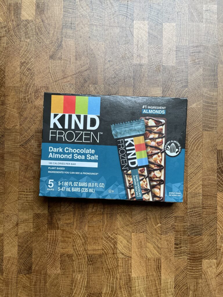 Kind frozen dark chocolate almond sea salt plant-based frozen desert package.