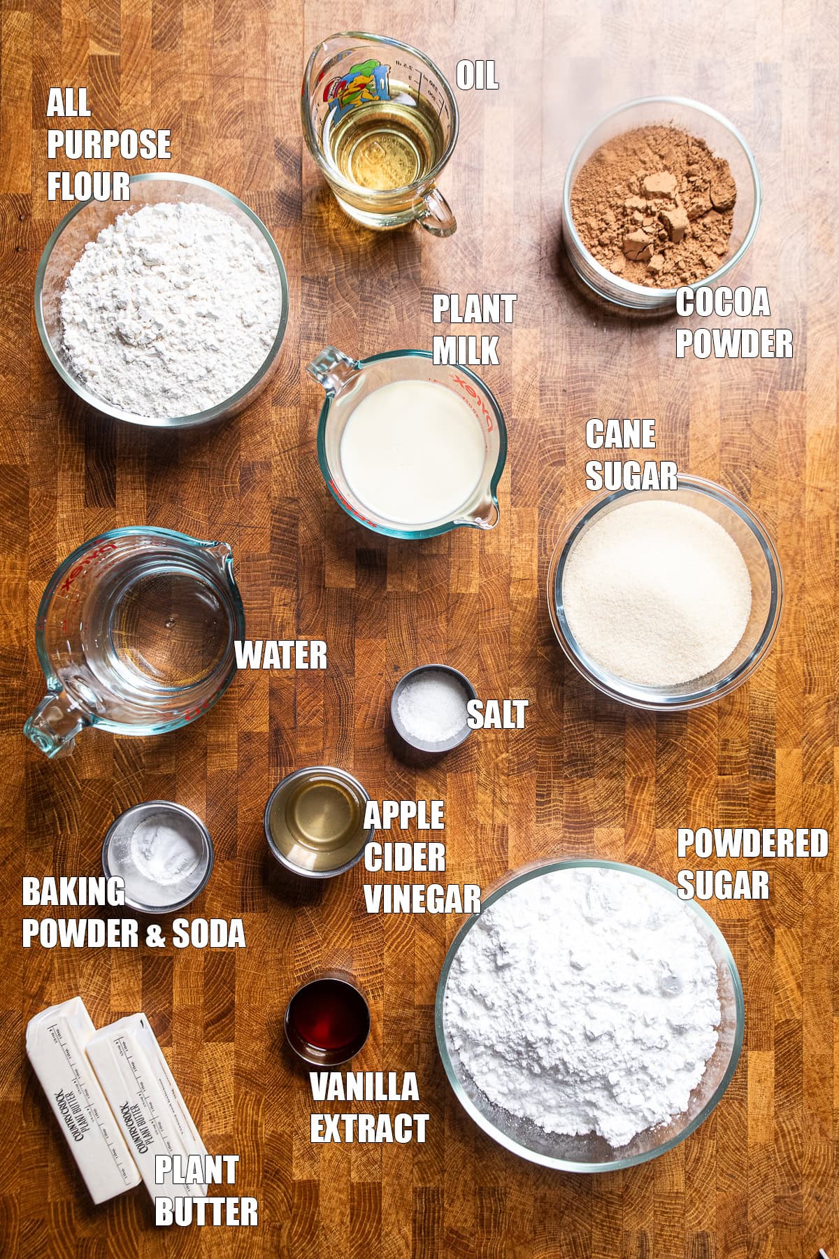 ingredients laid out and labeled to make a vegan chocolate cake.