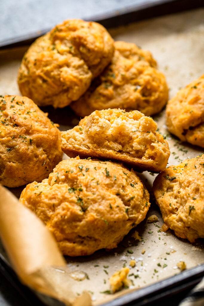 An assortment of vegan cheddar bay biscuits together.
