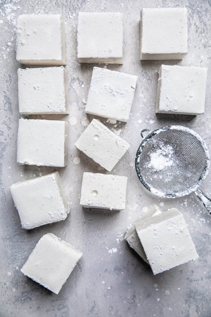 A batch of vegan marshmallows cut into squares.