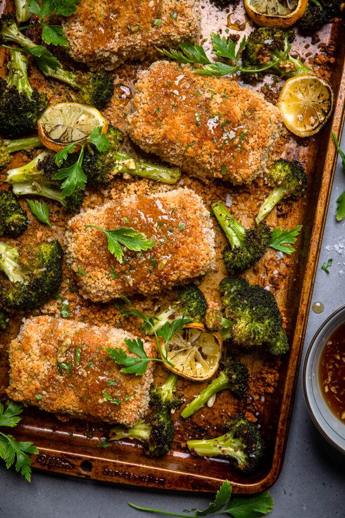 A sheet pan of vegan honey garlic oven fried tofu with broccoli. 