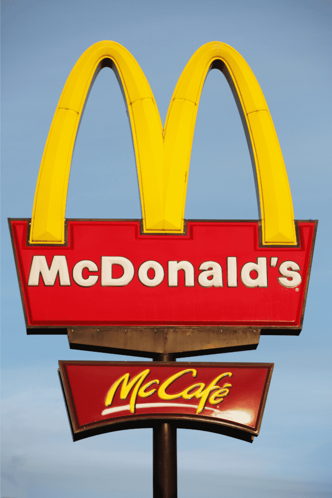 McDonald\'s sign over a sky backdrop.
