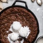 a double chocolate chip vegan cookie skillet with ice cream.