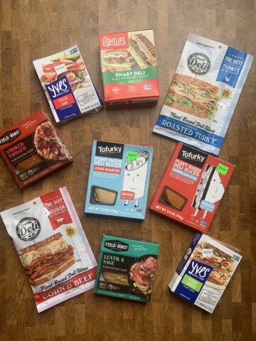 An assortment of vegan deli meat product packages.