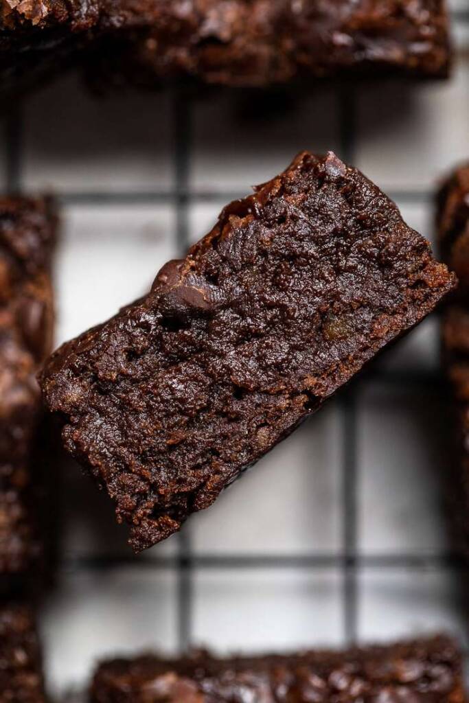 One vegan brownie sideways to see the inside fudgey texture. 