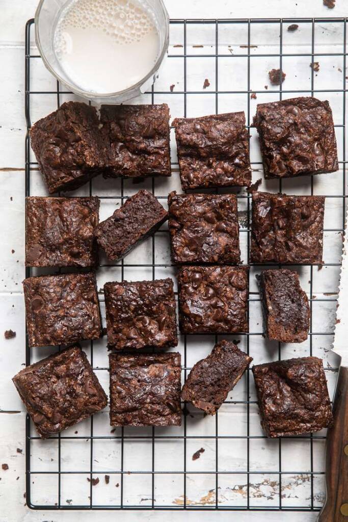 cut squares of the best vegan brownies on a wire baking rack. 