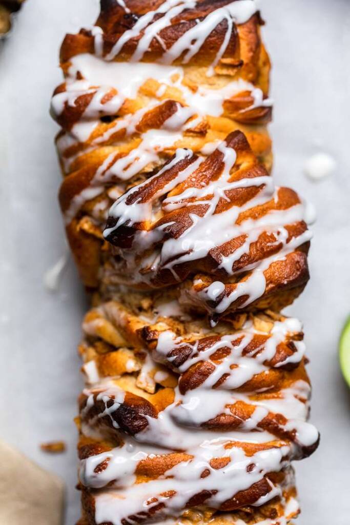 The top of Vegan apple pull apart bread with glaze.