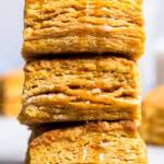 A stack of flakey vegan sweet potato buttermilk biscuits.