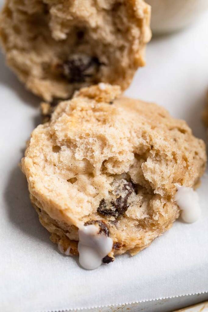 The inside of a Vegan iced cinnamon raisin biscuit to show fluffy texture. 