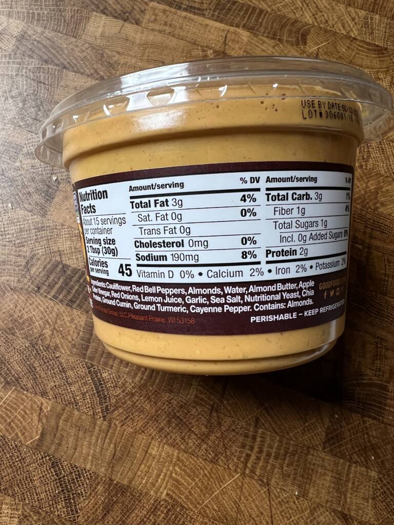 A container of Good Foods plant-based queso style dip nutritional and ingredient label. 