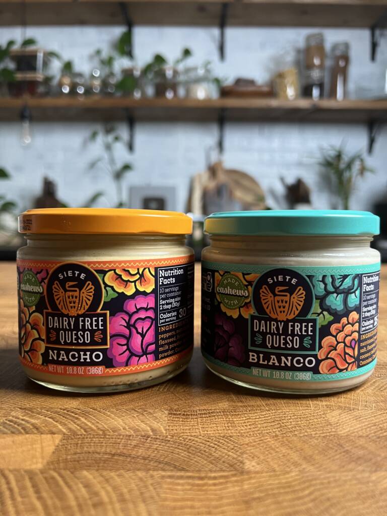 2 jars of Siete dairy free queso nacho and blanco flavors side by side. 