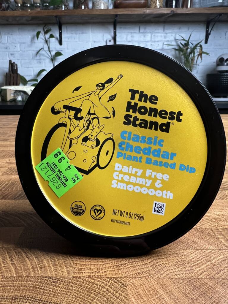 The honest stand classic cheddar cheese plant-based dip package. 