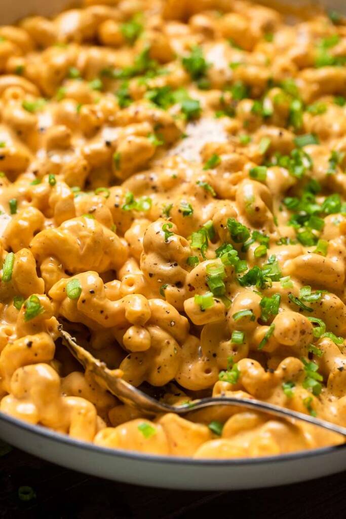 A zoomed in shot of extra cheesy easy vegan buffalo mac and cheese.
