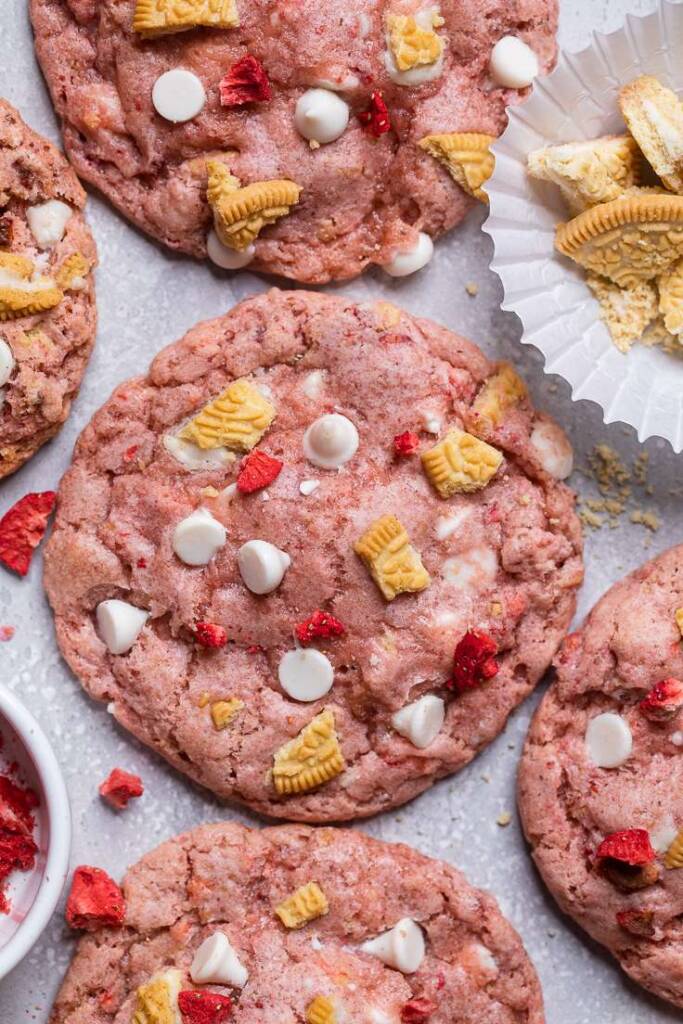 A close up of a pink vegan strawberry shortcake cookie.