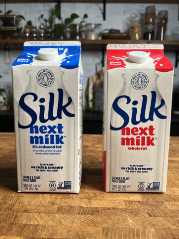 Two cartons of Silk next milk, one whole and one two percent.