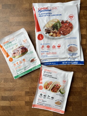 An assortment of OmniPork vegan pork product packages.