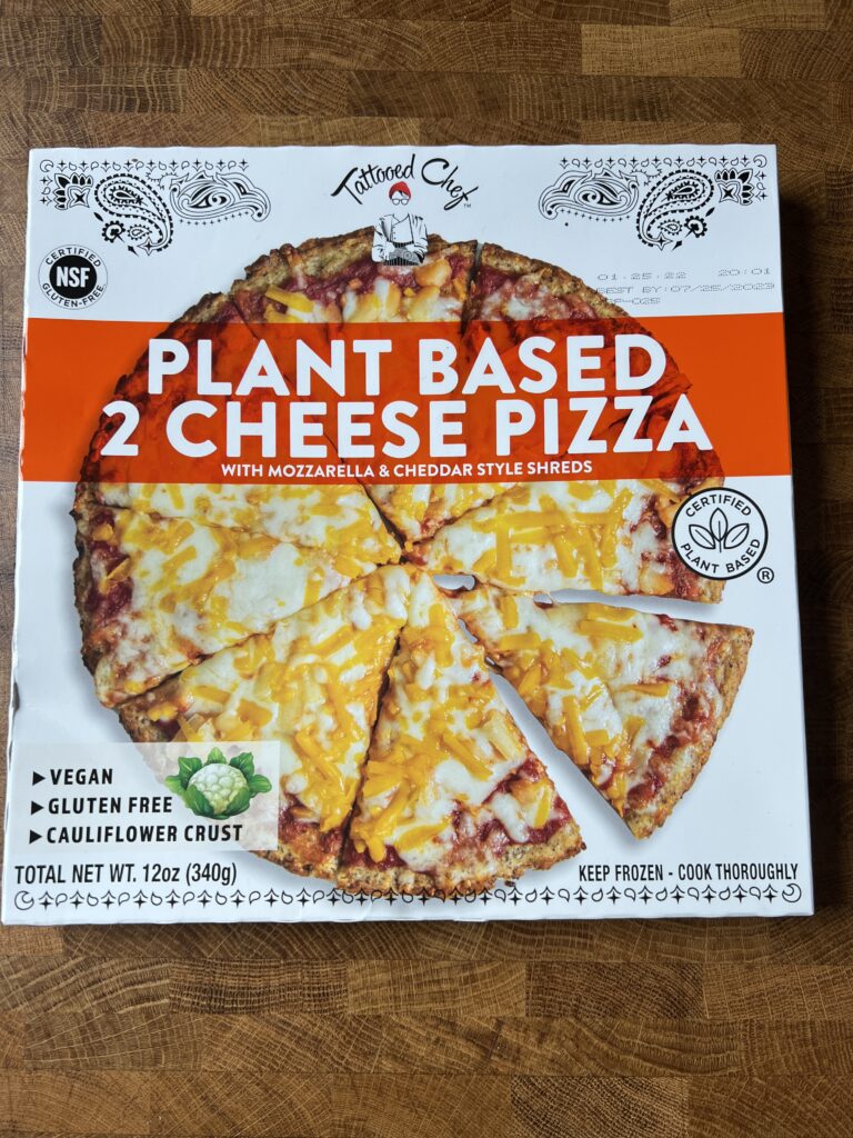a box of Tattooed chef vegan plant based 2 cheese pizza.