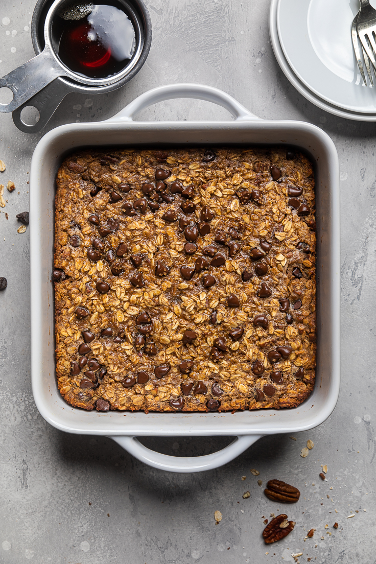 Vegan banana bread baked oatmeal cooked in a white casserole dish.