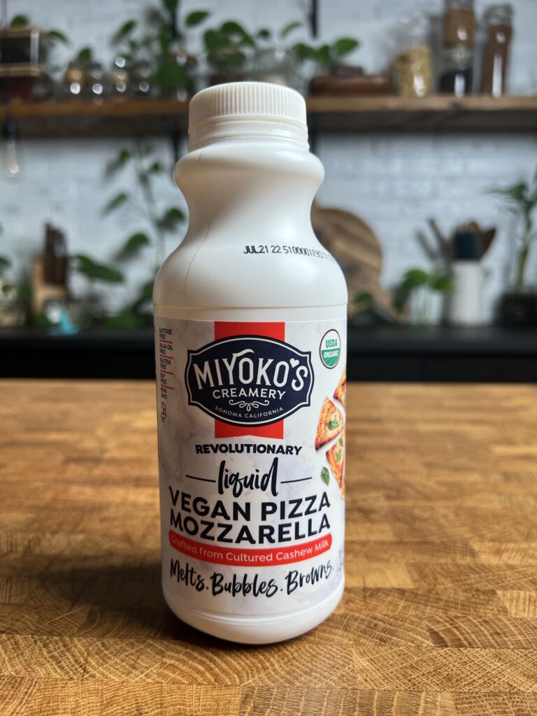 A bottle of Miyoko\'s liquid vegan pizza mozzarella.