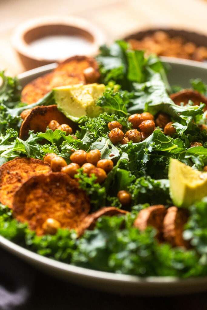 A close up of plate of high protein vegan kale salad.