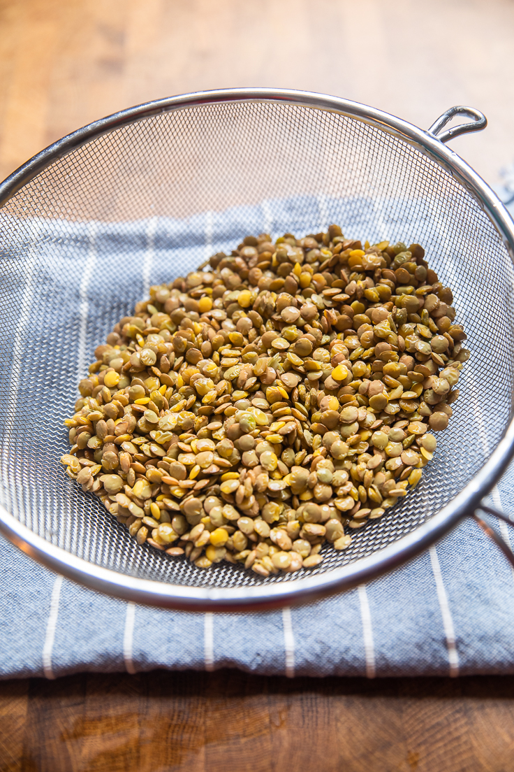 washed and drained lentils in a sifter.