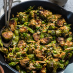 Oven roasted Brussels sprouts and edamame with spicy peanut sauce.