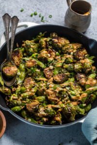 Oven roasted Brussels sprouts and edamame with spicy peanut sauce.