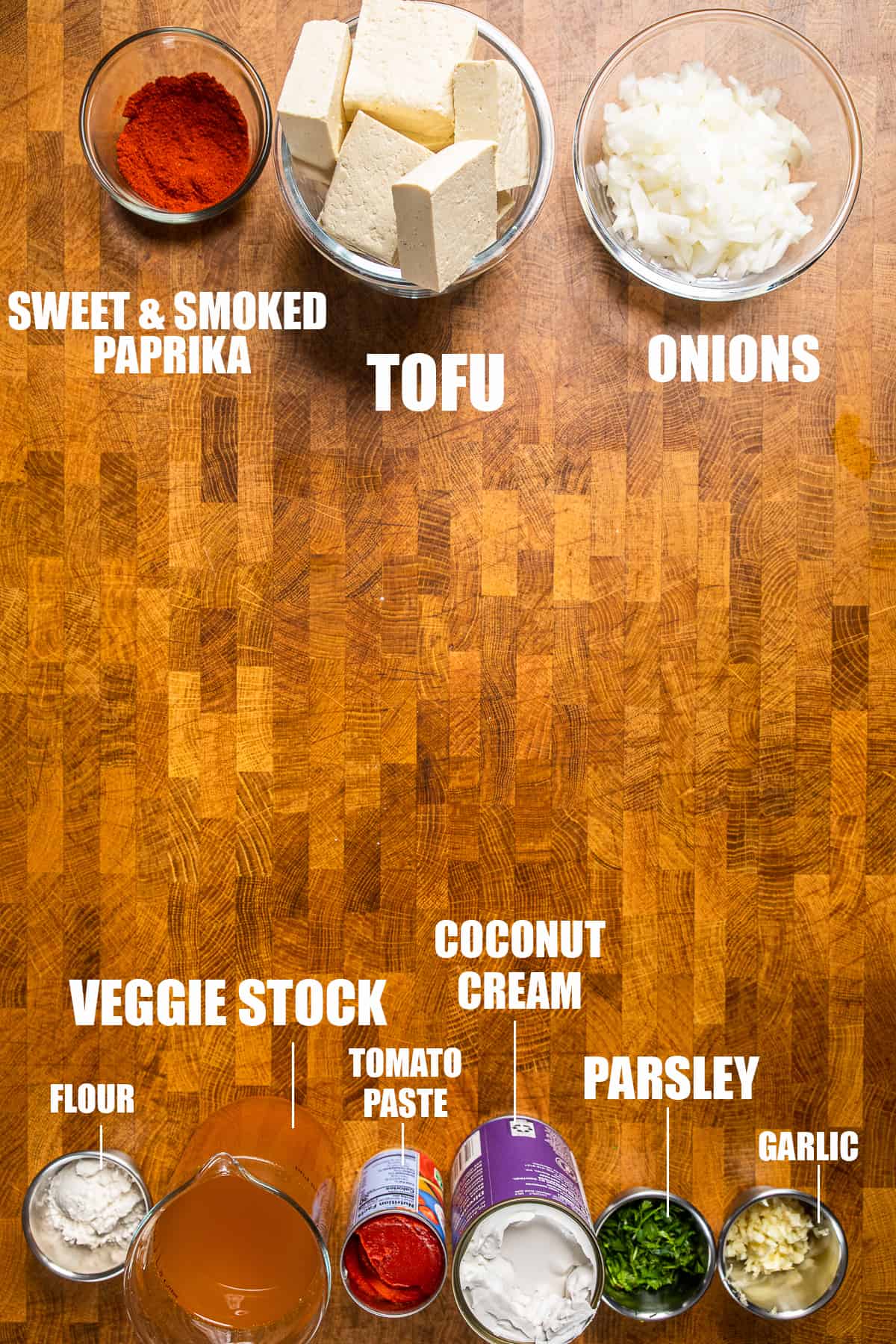 vegan tofu paprikash ingredients on a wooden table.