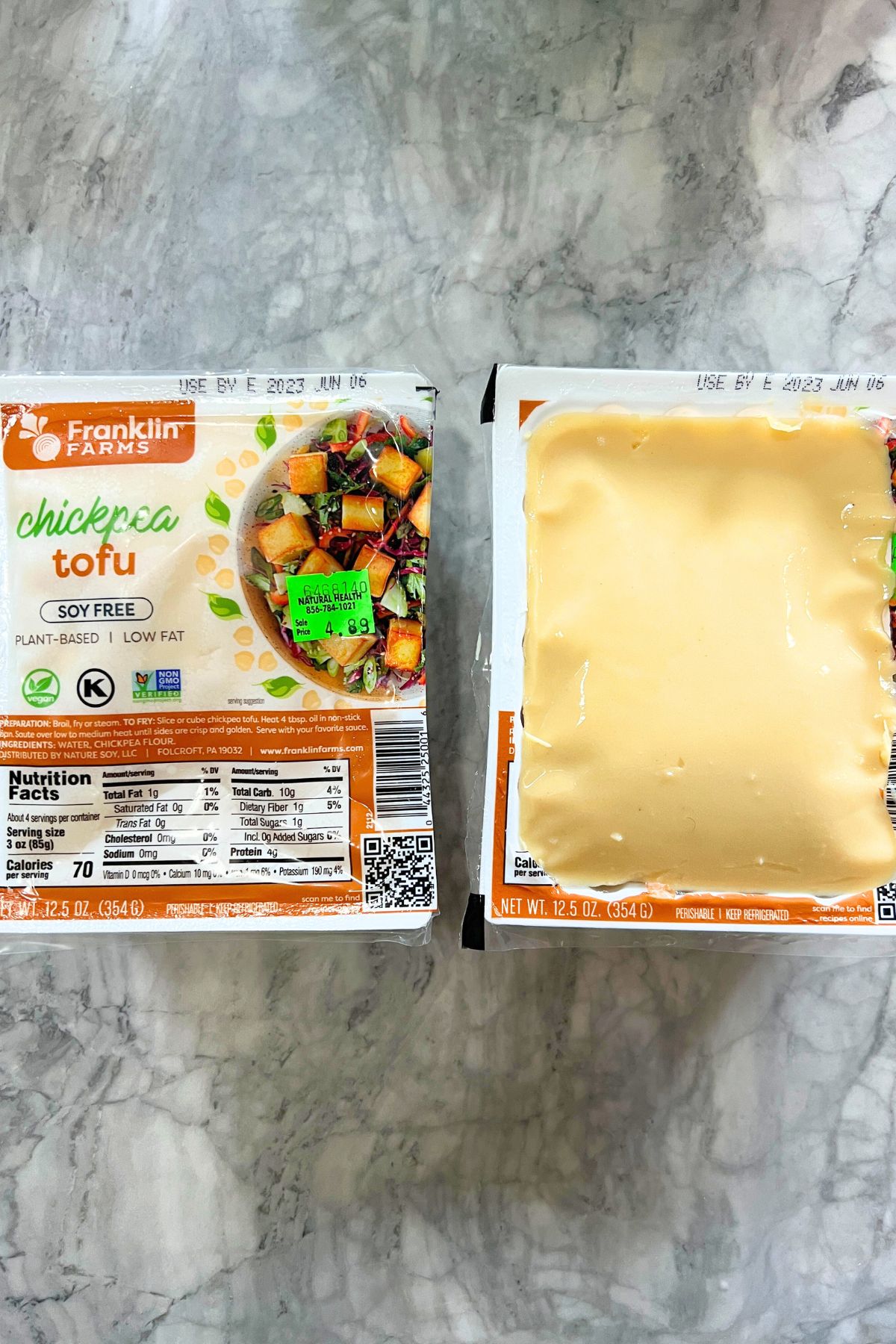 two packages of chickpea tofu, one opened to show smooth texture.