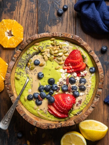 vegan green smoothie bowl on a table.