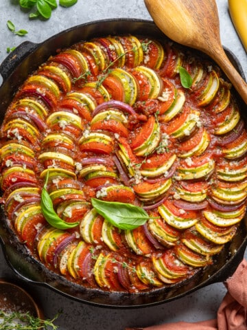 cooked ratatouille in a large black skillet.