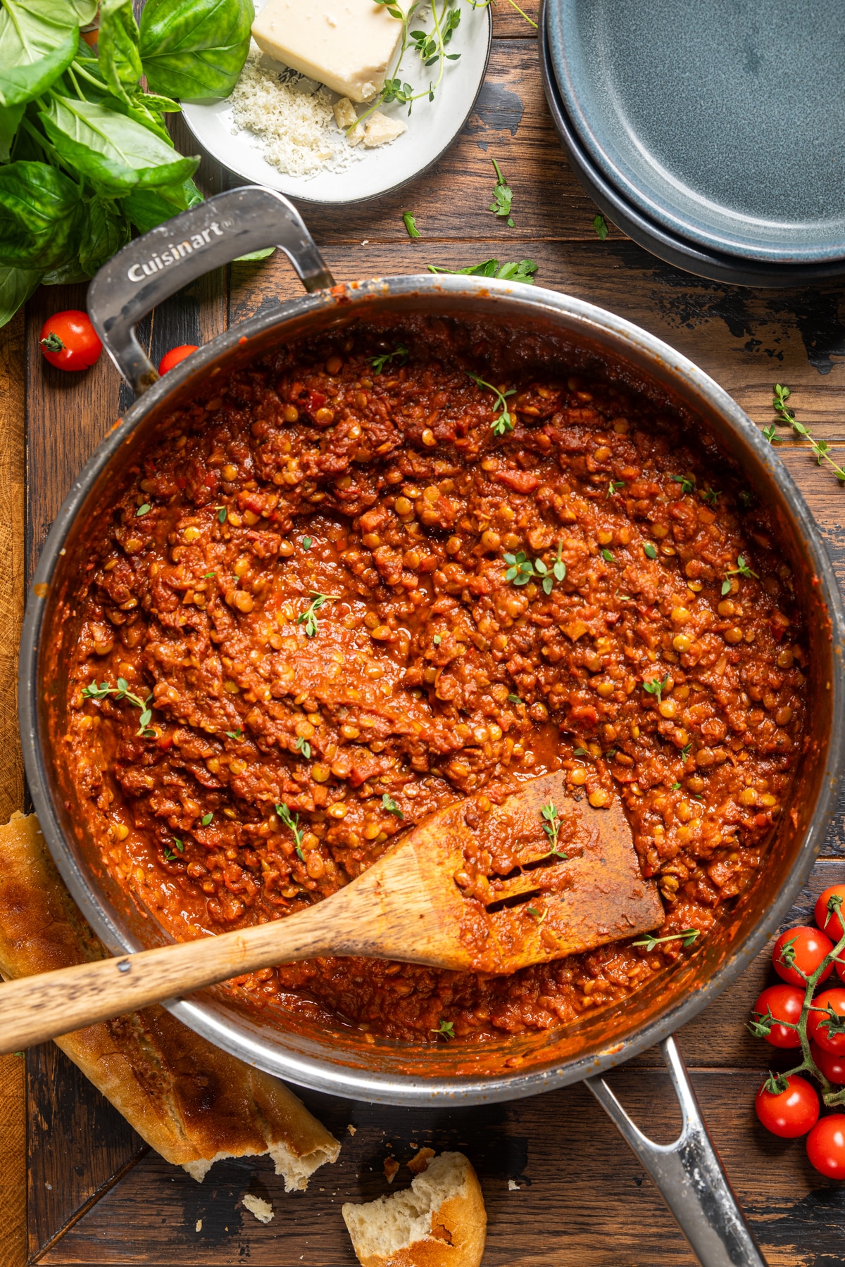 lentil bolognese in a large pot with a wooden spoon.