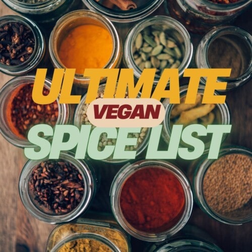 a table filled with a variety of bowls, each with a different spice, with the words ultimate vegan spice list overlayed.