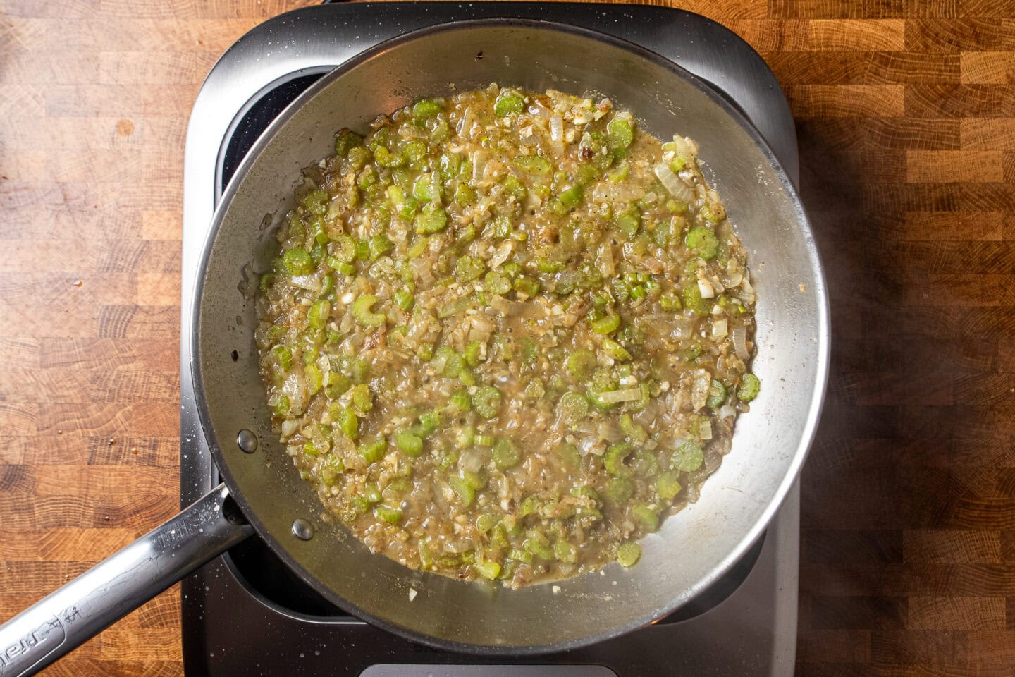a liquidy mixture of vegetables and seasonings for a vegan stuffing.