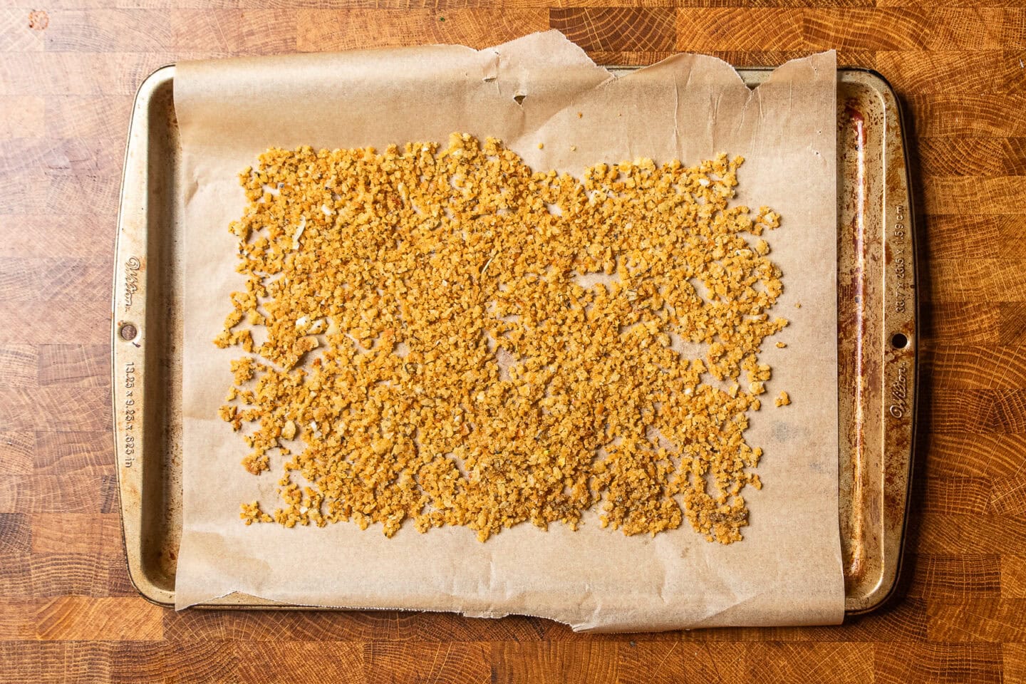 toasted breadcrumbs on a baking tray.