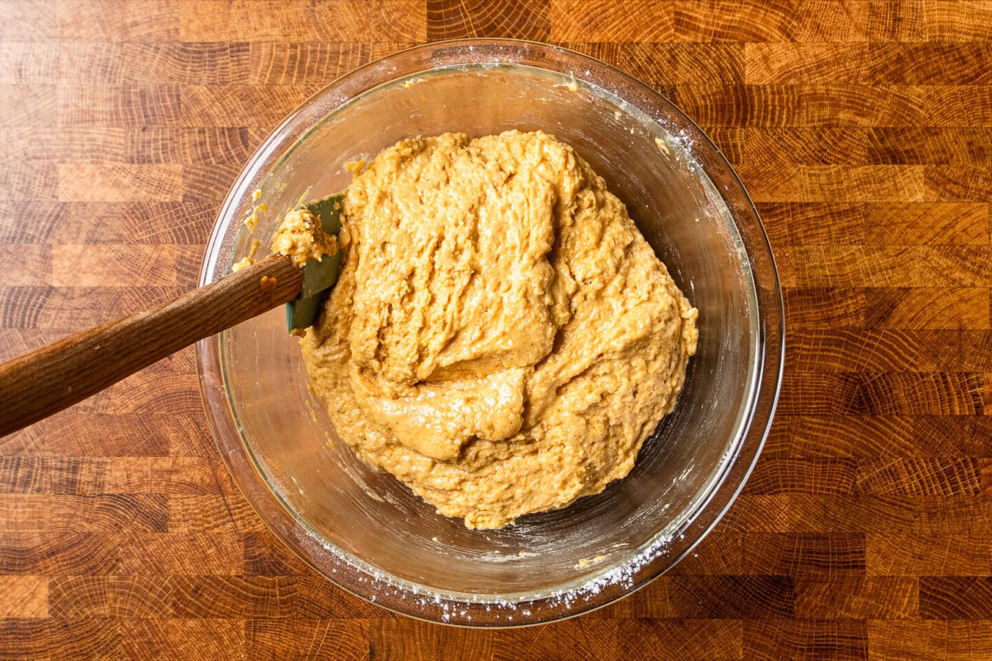sweet potato cornbread batter in a glass bowl.