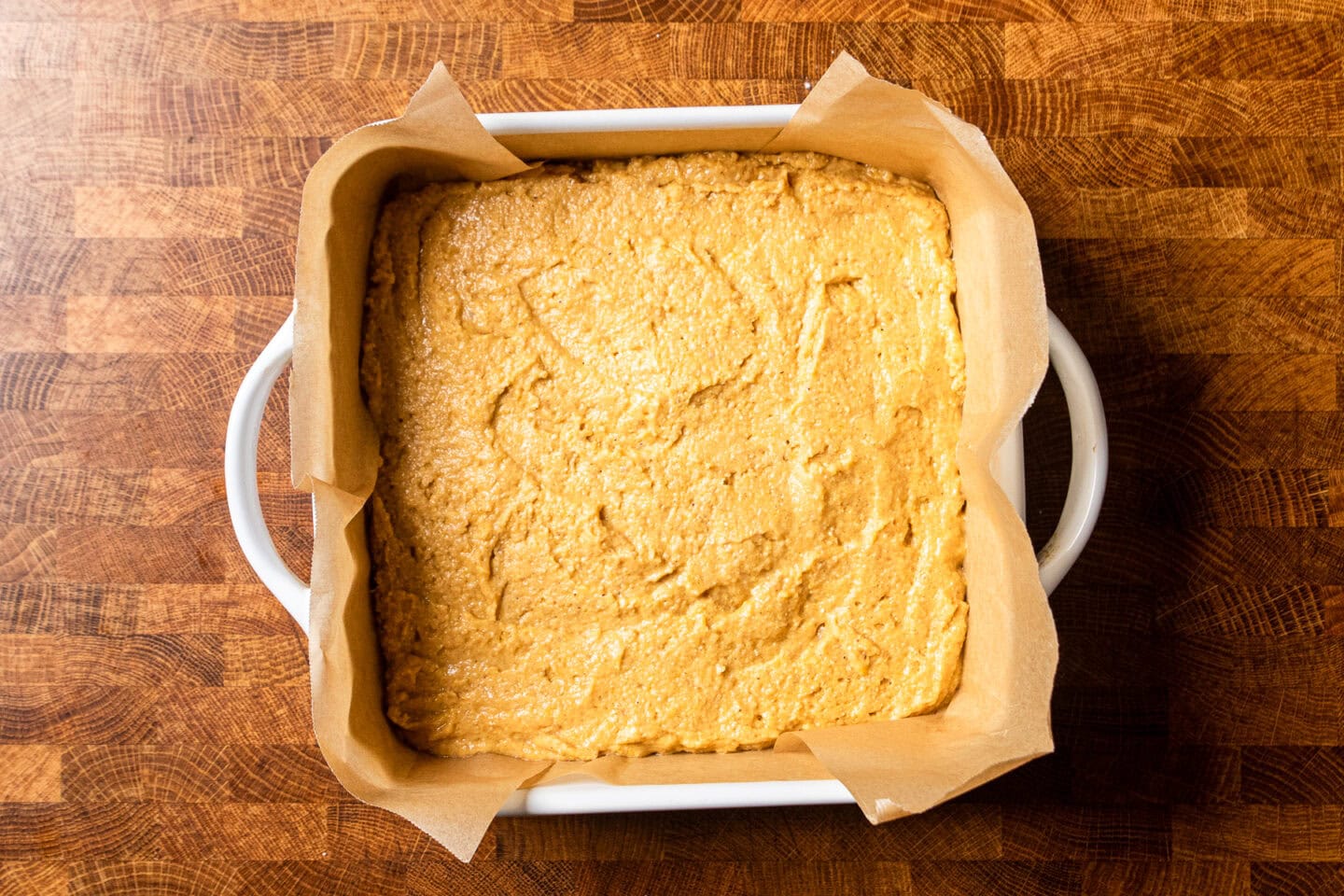 sweet potato cornbread batter in a baking dish.