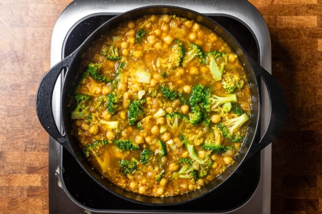 broccoli and chickpea soup cooking on the stove.