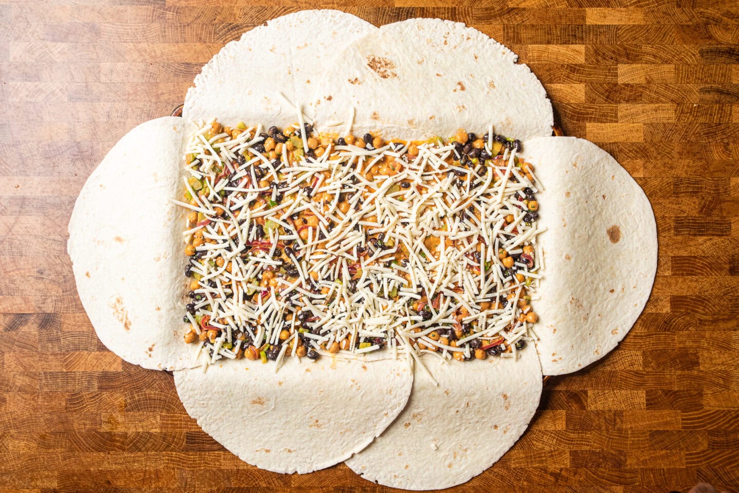 a sheet pan quesadilla with filling prior to being folded up.