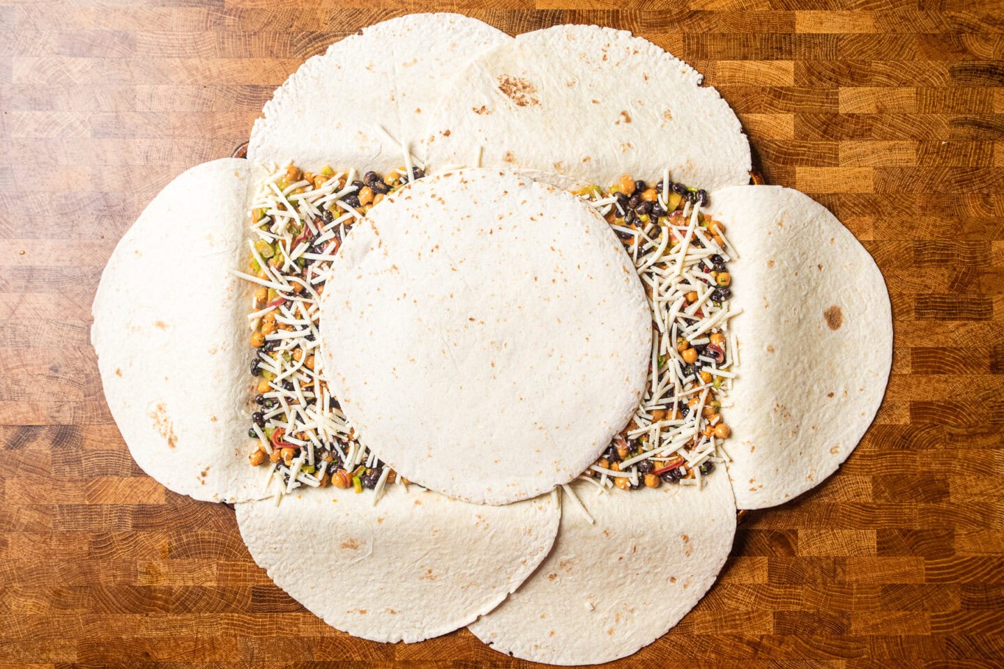 a sheet pan quesadilla with filling prior to being folded up.