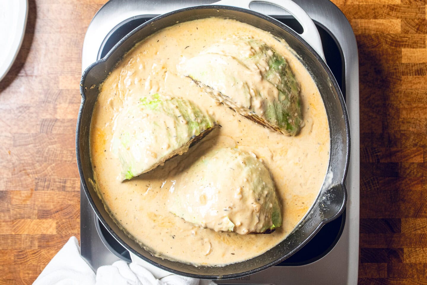 seared cabbage in a vegan miso garlic butter sauce before going into oven to be roasted.