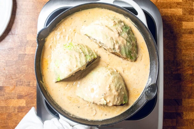 seared cabbage in a vegan miso garlic butter sauce before going into oven to be roasted.