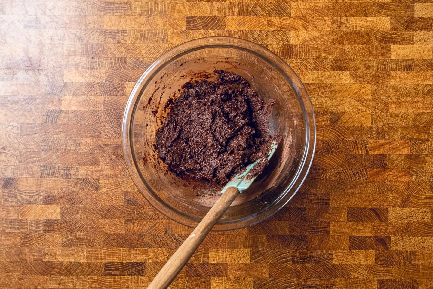 sweet potato brownie mix in a glass bowl mixed together.