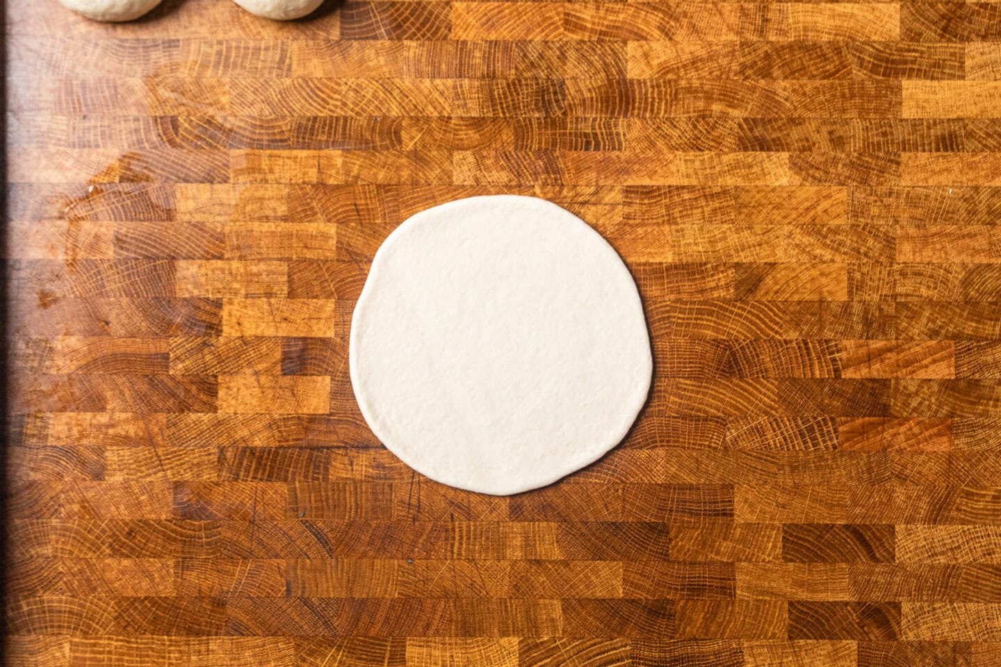 a round circle of dough on a table.