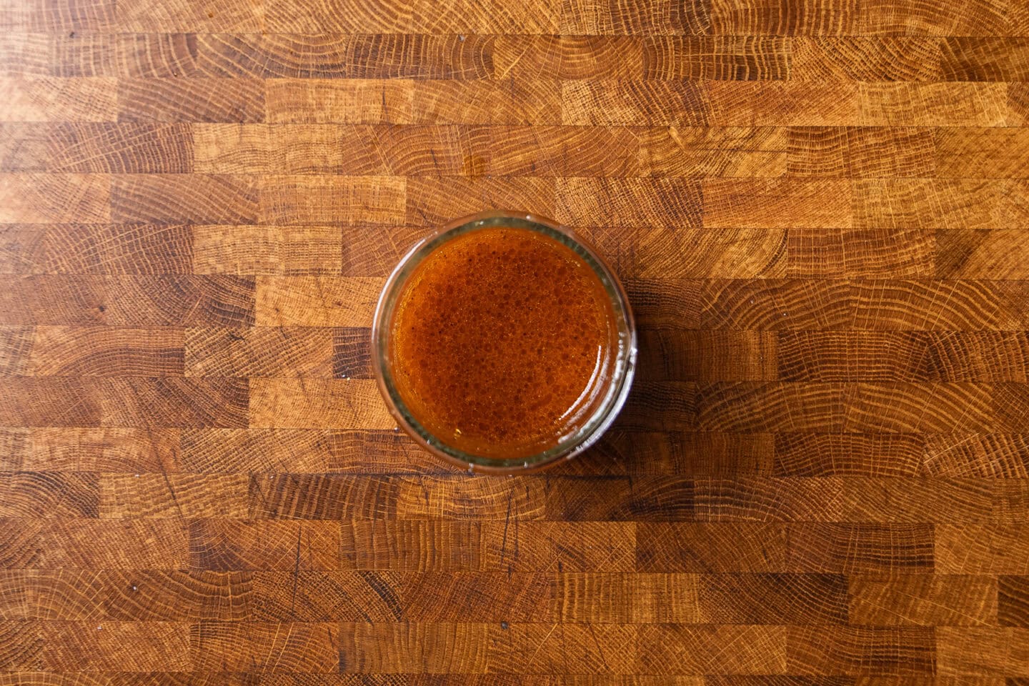 citrus harissa dressing in a glass jar.