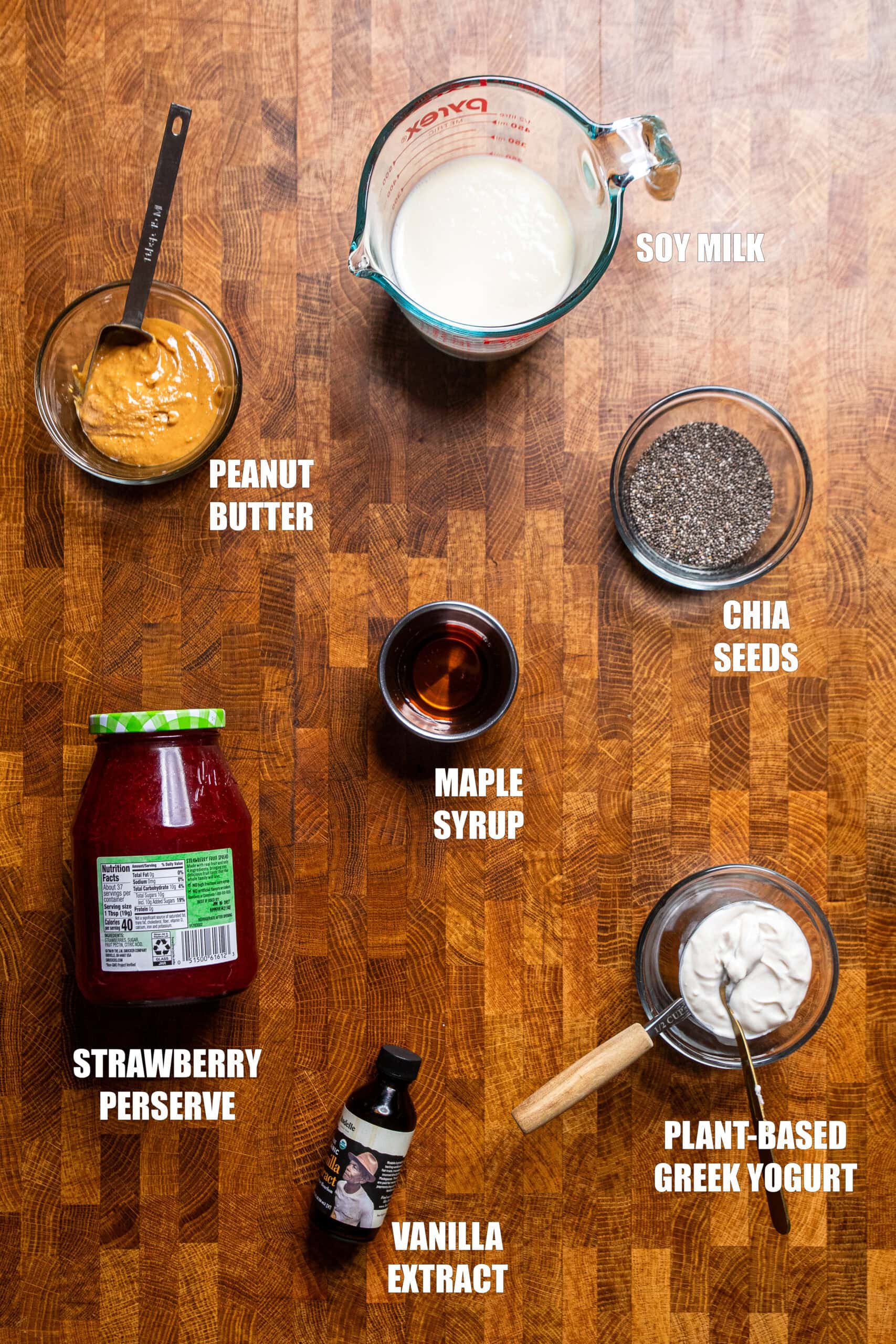 table of ingredients to make peanut butter and jelly chia seed pudding.