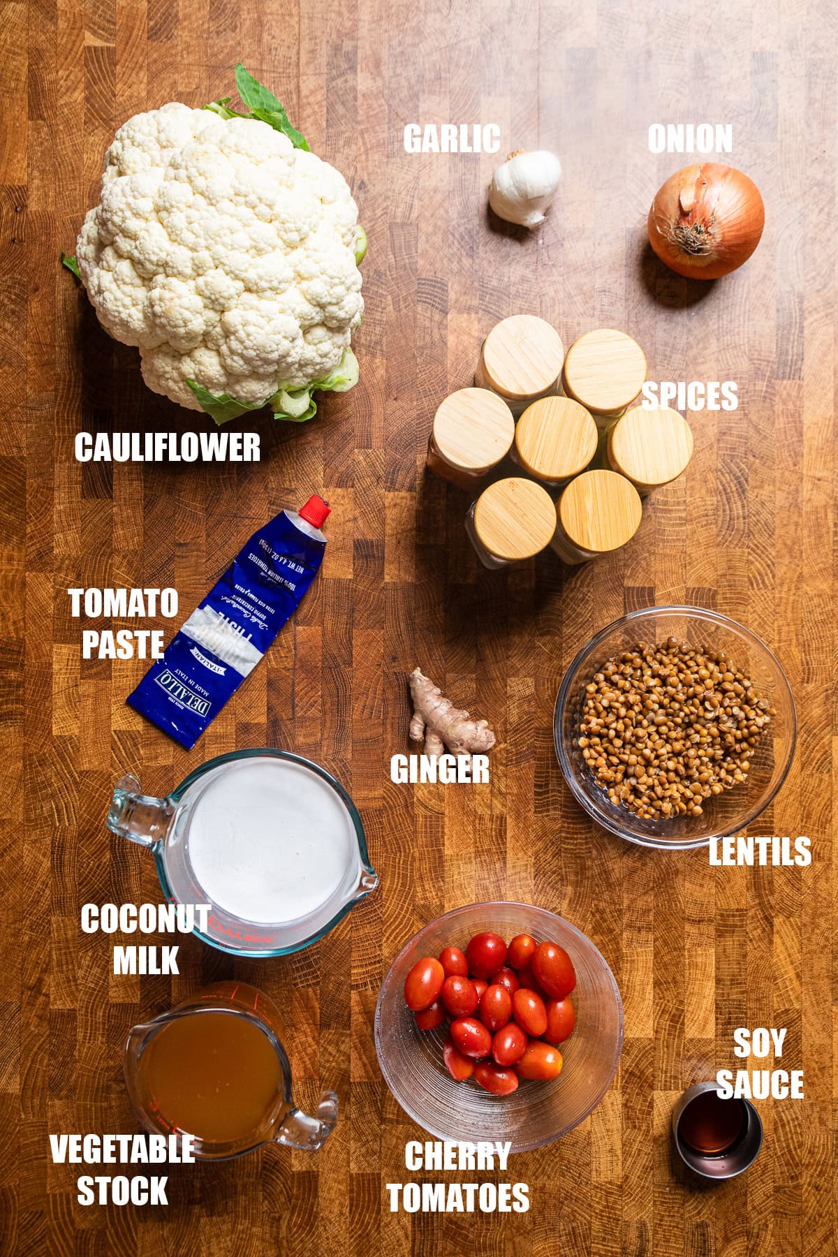 ingredients on a table to make roasted cauliflower and lentils with a creamy coconut tomato sauce.